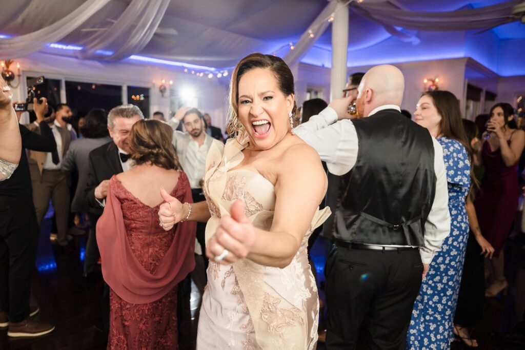 bride's mom celebrating on dance floor at Mansion at West Sayville