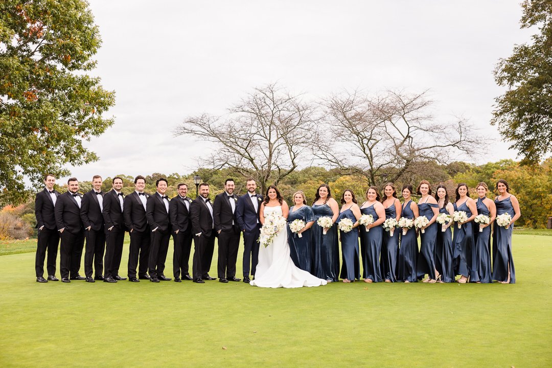 bridal party on putting green at Heritage Club