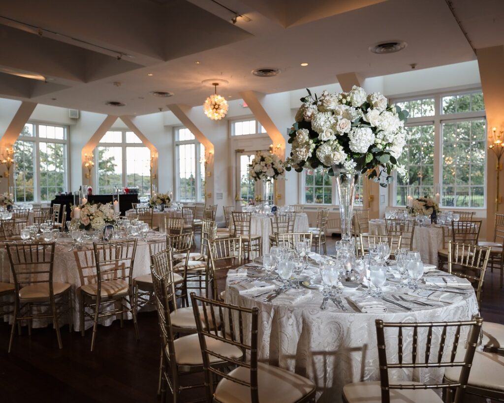 Table settings for an indoor wedding reception. 