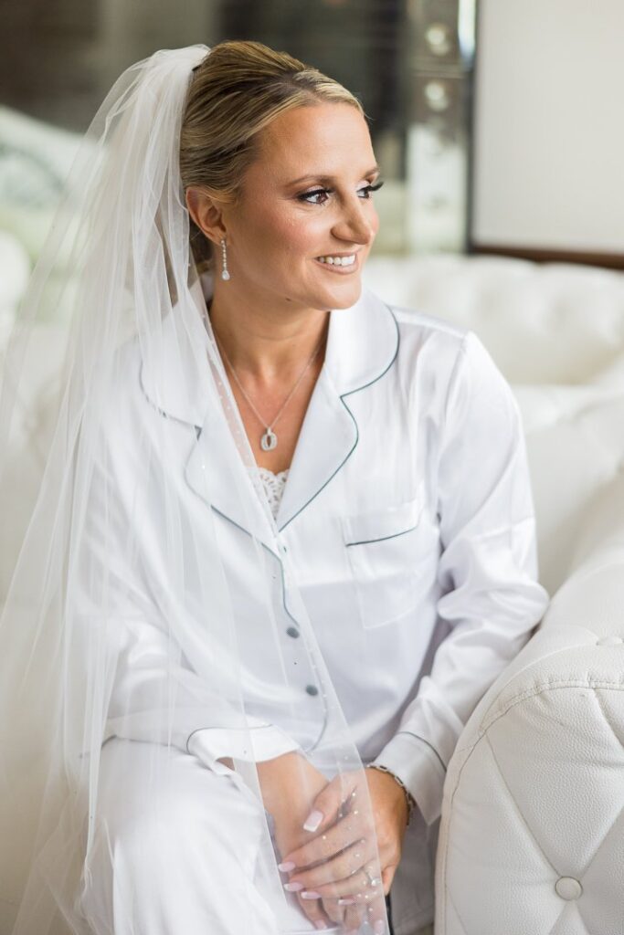 bride in robe and veil at Gatsby On The Ocean