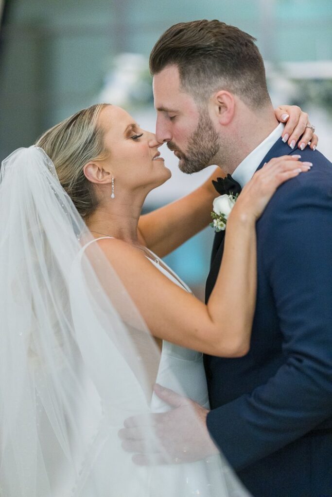 bride groom about to kiss at Gatsby On The Ocean