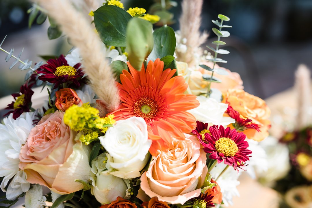 vibrant flowers with pampas grass