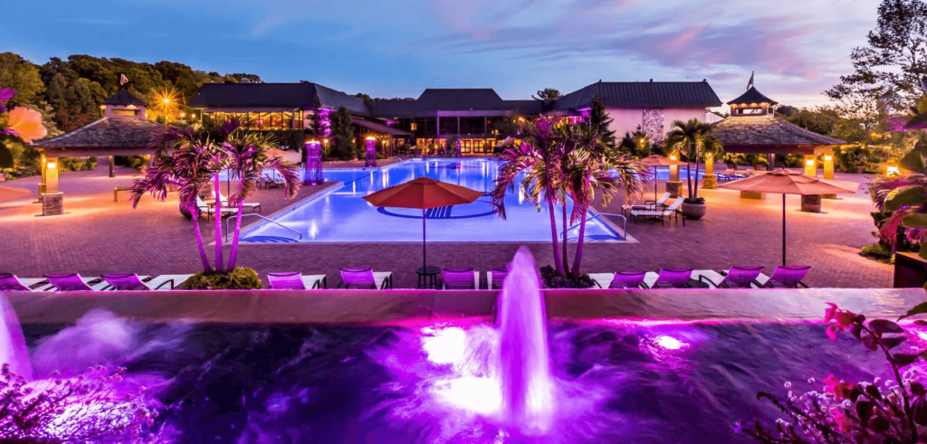 Luxurious poolside area where guests can enjoy a relaxing evening during a wedding reception.