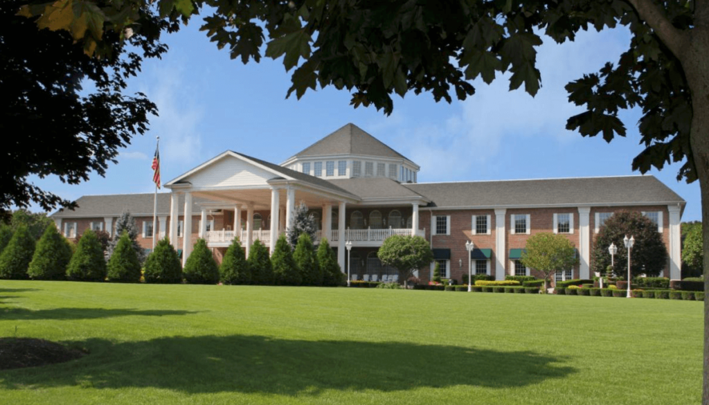 View of the manicured grounds and grand entrance at East Wind.