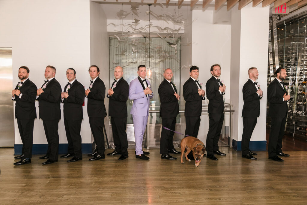 Groom and groomsmen in the bar of the Allegria Hotel