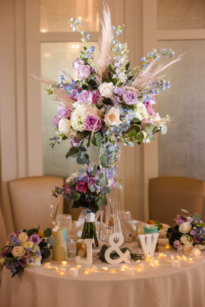 Centerpiece at sweetheart table for Allegria Hotel Wedding