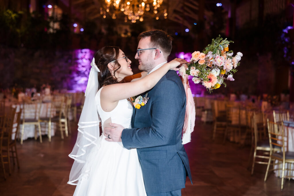 Couple dancing first dance in Winter Garden at Fox Hollow before guests arrive.