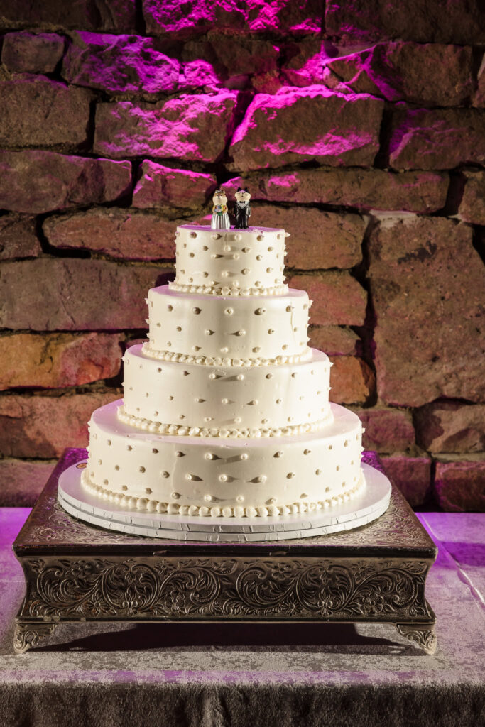 4 tierred wedding cake in Winter Garden room at Fox Hollow.