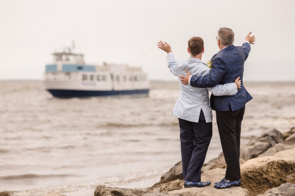 Couple waving at boat going to Fire Island