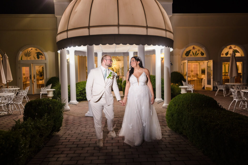 Couple walking near gazebo at Majestic Gardens.