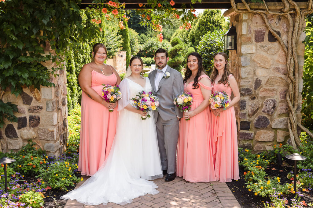 Bride and groom with bridesmaids at Larkfield.