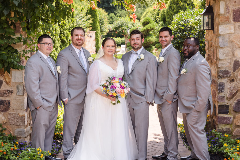 Bride and groom with groomsmen at Larkfield.