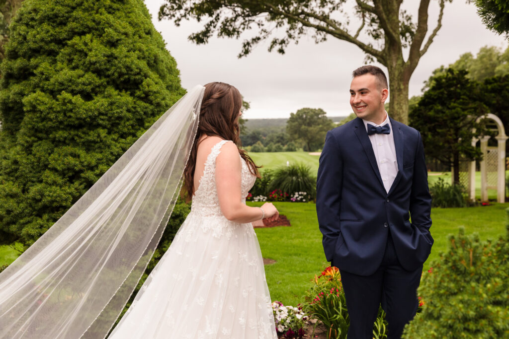 Groom turning to see bride for the first time at Rock Hill Country Club.