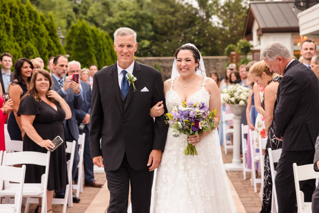 Bride and her father walking down the aisle at The Somerly.