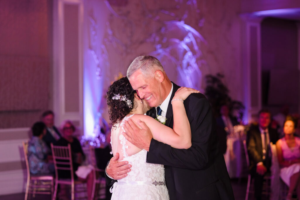 Bride dancing with her dad during wedding recpetion.