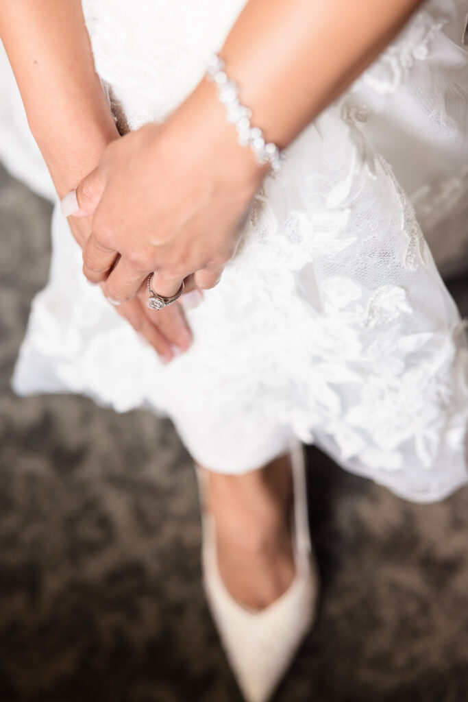 Bride putting on her shoes at The Coral House bridal suite. 