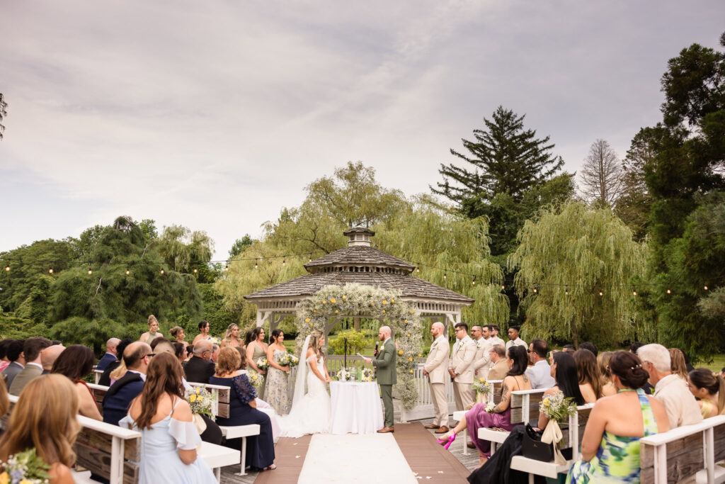 Bride and groom at outdoor ceremony at Flowerfield.