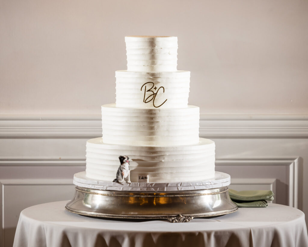 Cake at Flowerfield ballroom. The cake has a statue of a dog at the base. 