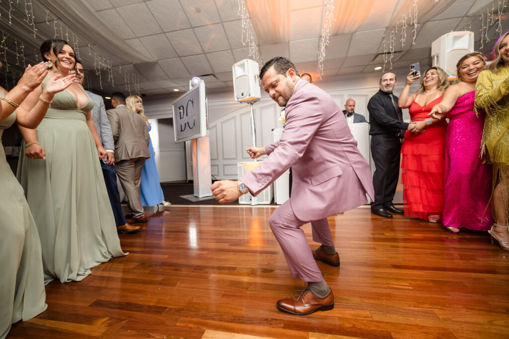 Man dancing on dance floor at Flowerfield. 