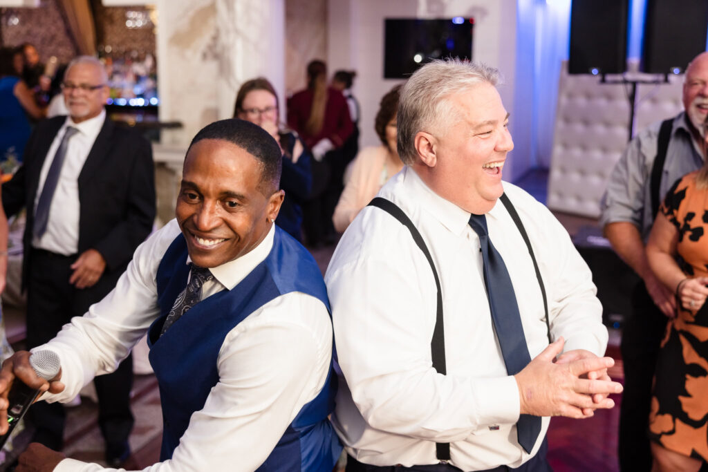 Groom and DJ dancing at Sand Castle Wedding Venue