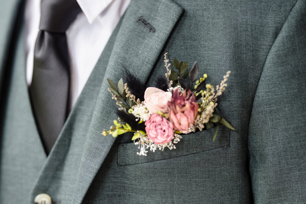 Close up of groom's boutonniere.