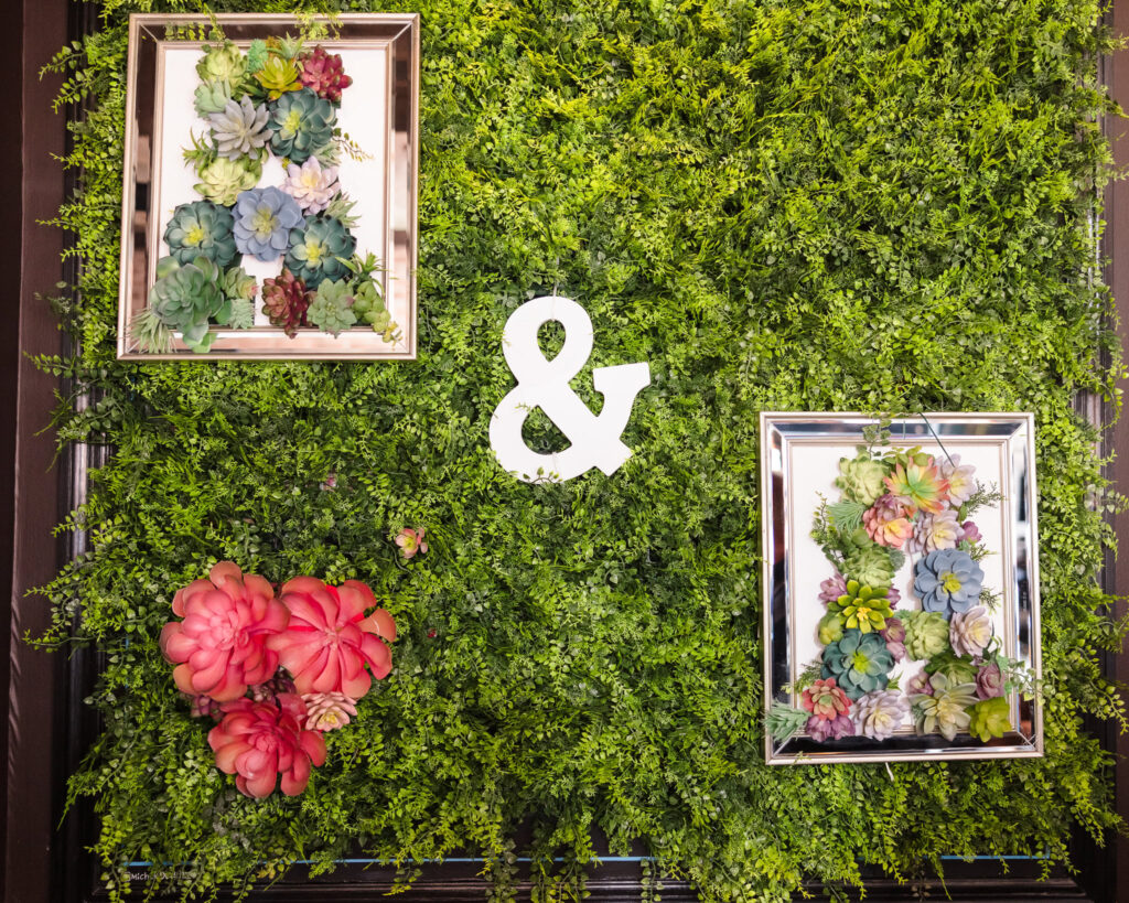 Green flower wall with two floral letter "A" at JJ Cooper's in Long Beach.