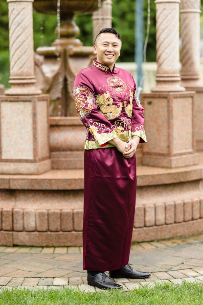 Groom in purple attire for Chinese Tea Ceremony at Sand Castle. 