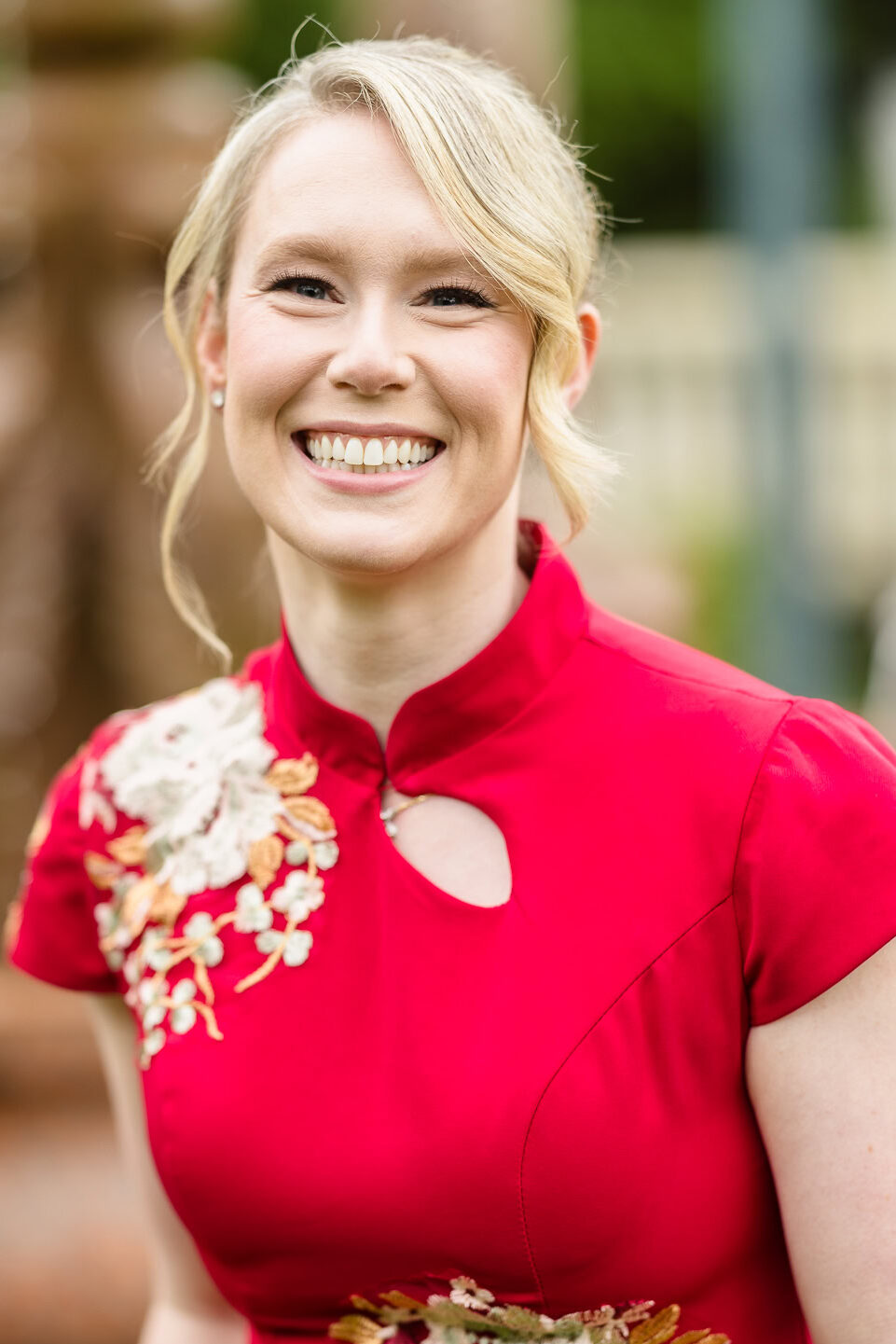 Bride in red dress for Chinese Tea Ceremony at Sand Castle. 