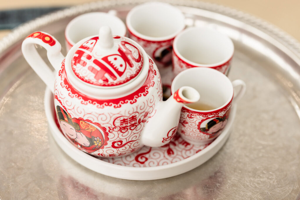 Red and white tea pot and cups at Sand Castle Wedding Venue.