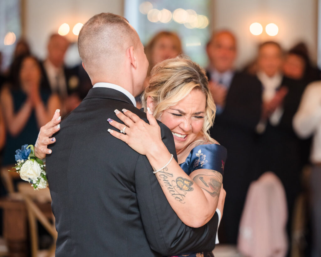 Groom and groom's mom dancing together.