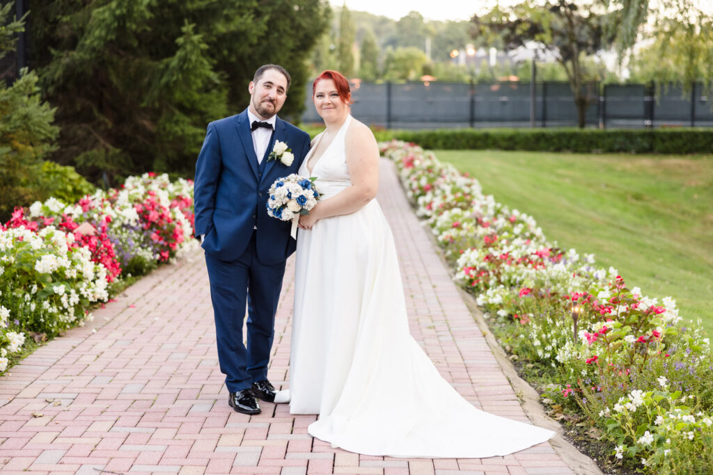 Bride and groom smiling and staring at the camera at their Crest Hollow Country Club wedding.