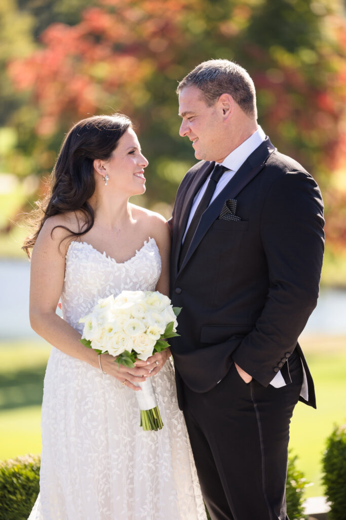 Bride and groom looking at each other at Glen Head Country Club.