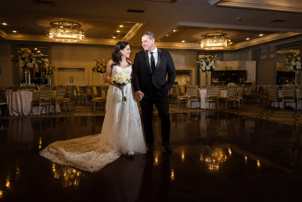 Bride and groom on ballroom dance floor at Glen Head Country Club. 