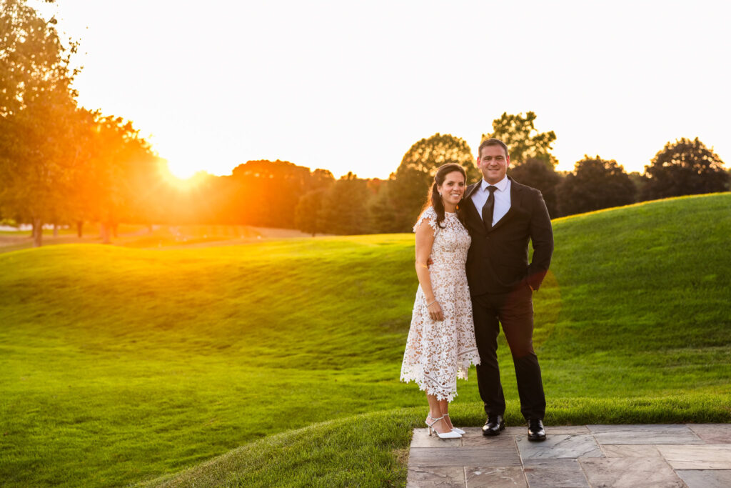 Bride and groom at sunset on the golf course at Glen Head Country Club.