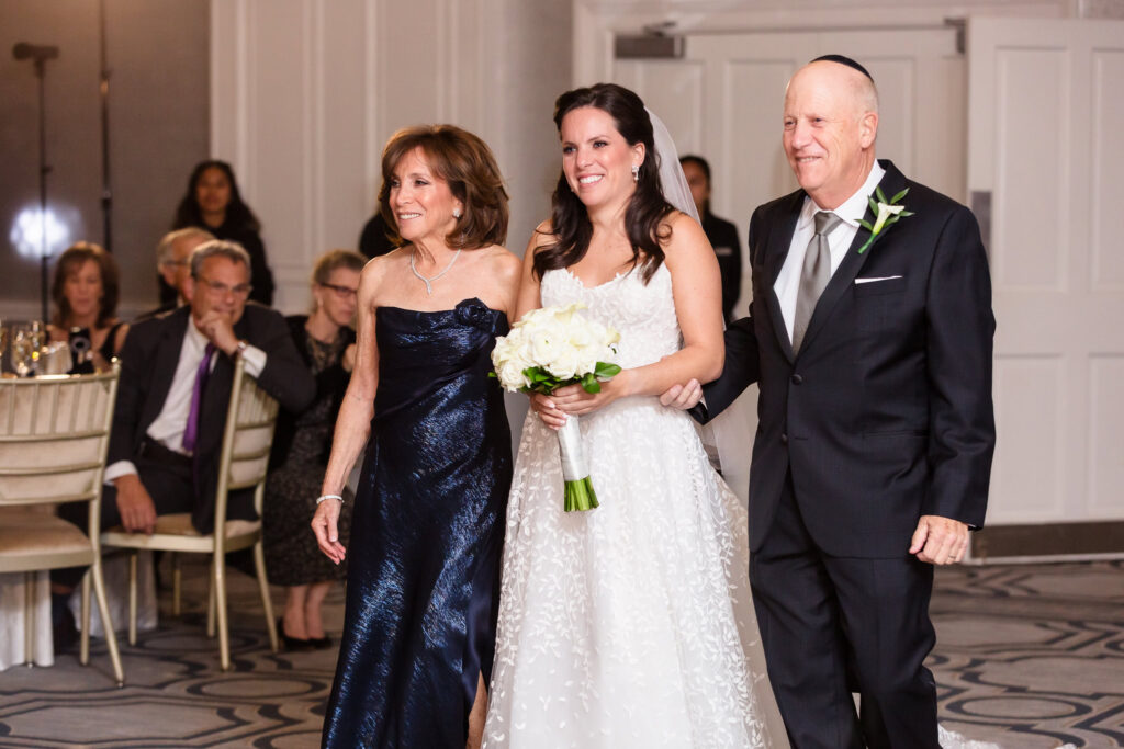 Bride walking down the aisle at Glen Head Country Club.