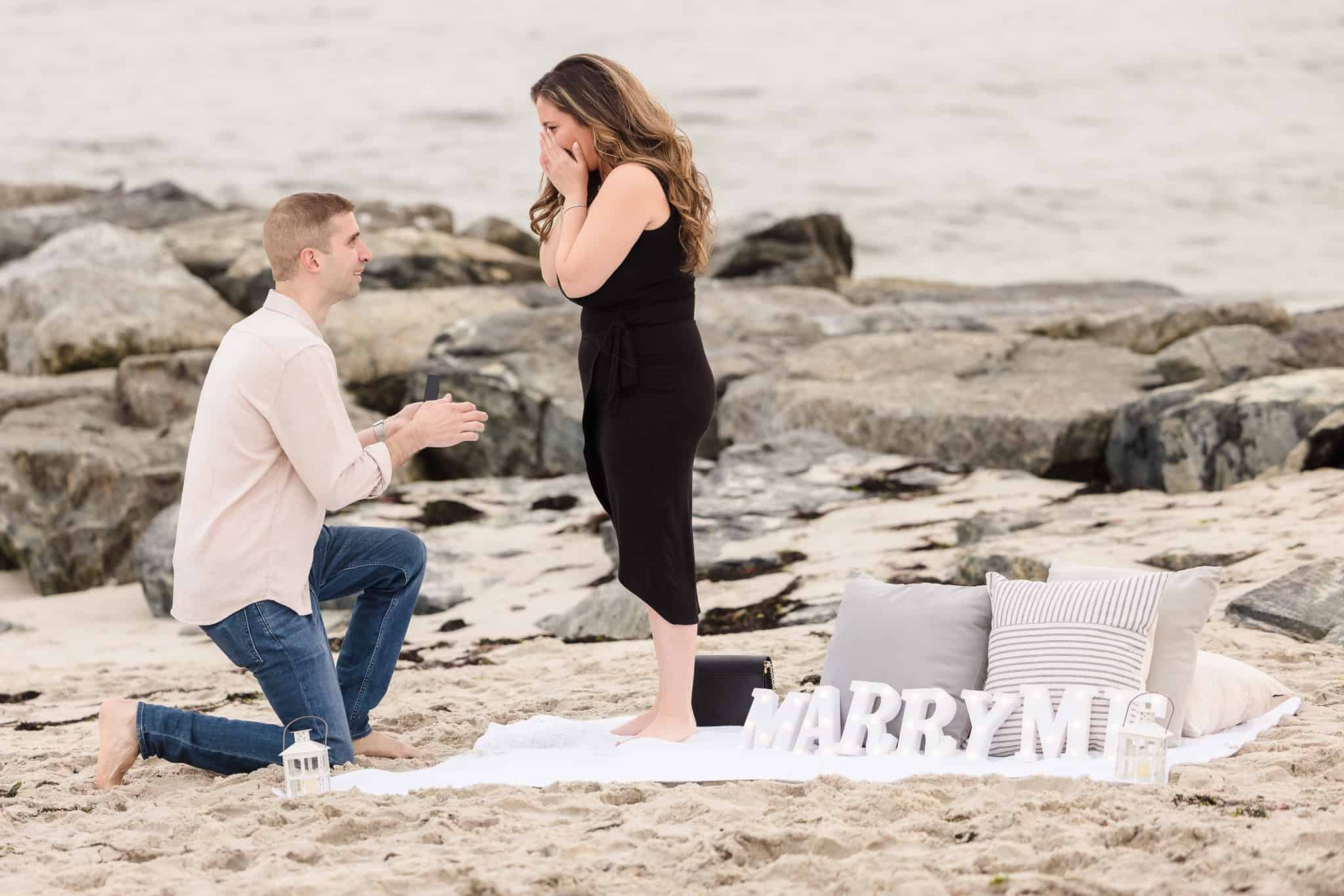 Man proposing to woman on a Long Island Beach