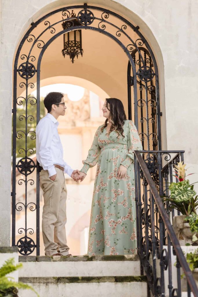 Couple looking at each other n doorway at Vanderbilt Museum. 