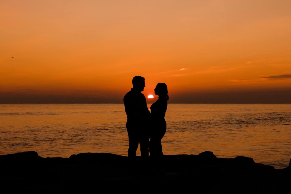 Silhouette of couple at sunset in Long Beach.