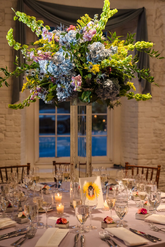 Tall centerpiece at New York Botanical Garden wedding at Stone Mill