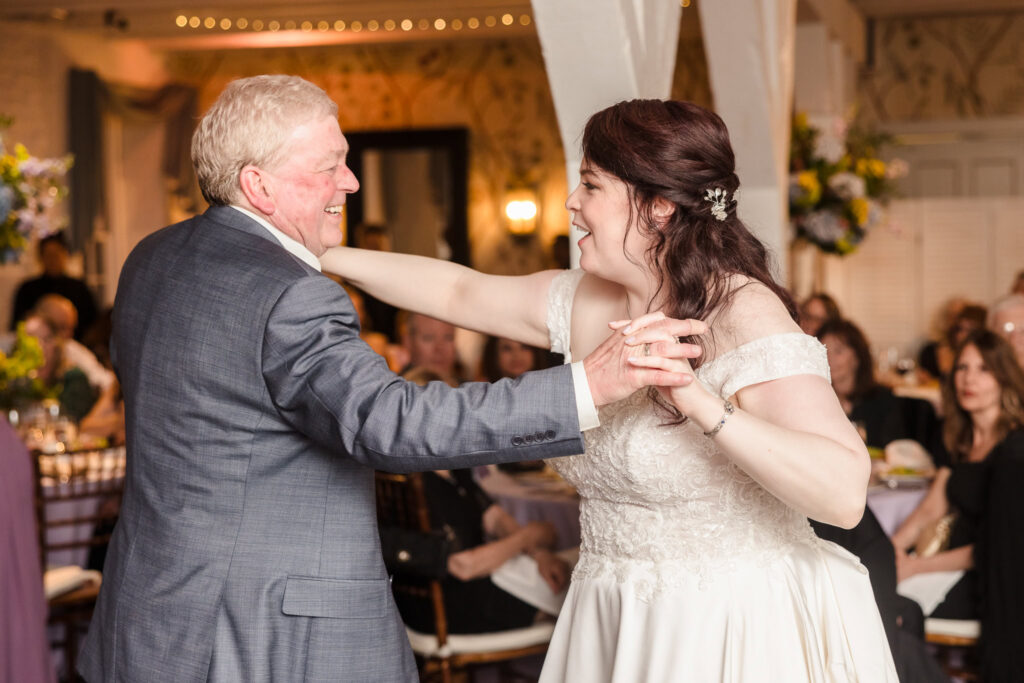 Bride and father of the bride dancing at Stone Mill wedding at NYBG