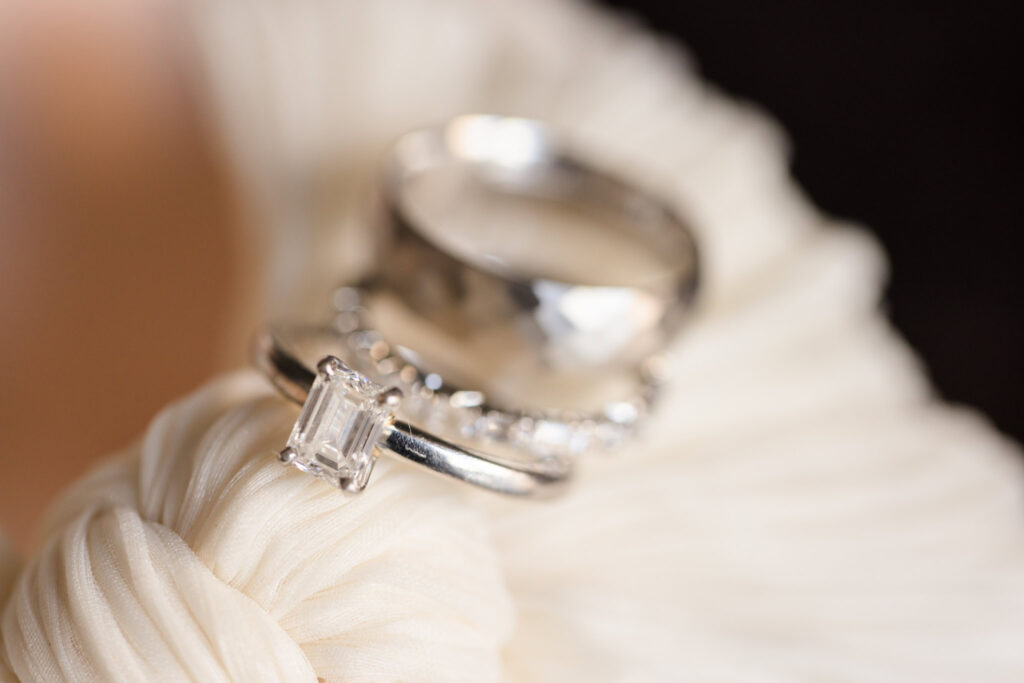 Wedding rings on top of bride's shoes at Hilton Midtown Manhattan.