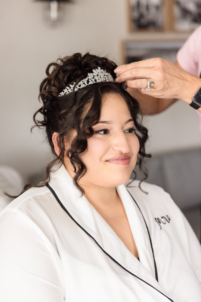 Bride in a chair at Danford's Hotel getting the finishing touches to her hair.