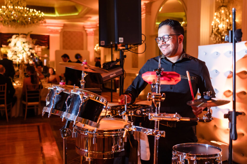 Drummer from Body Rock playing on dance floor of the Garden City Hotel.