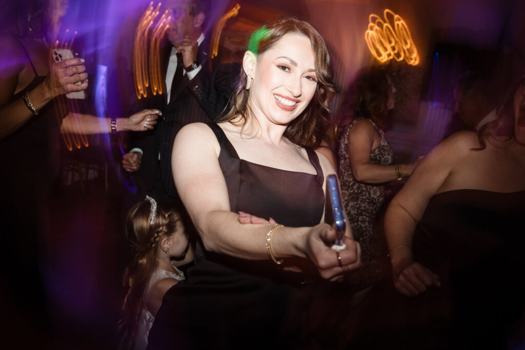 Person dancing on the dance floor at the Garden City Hotel.