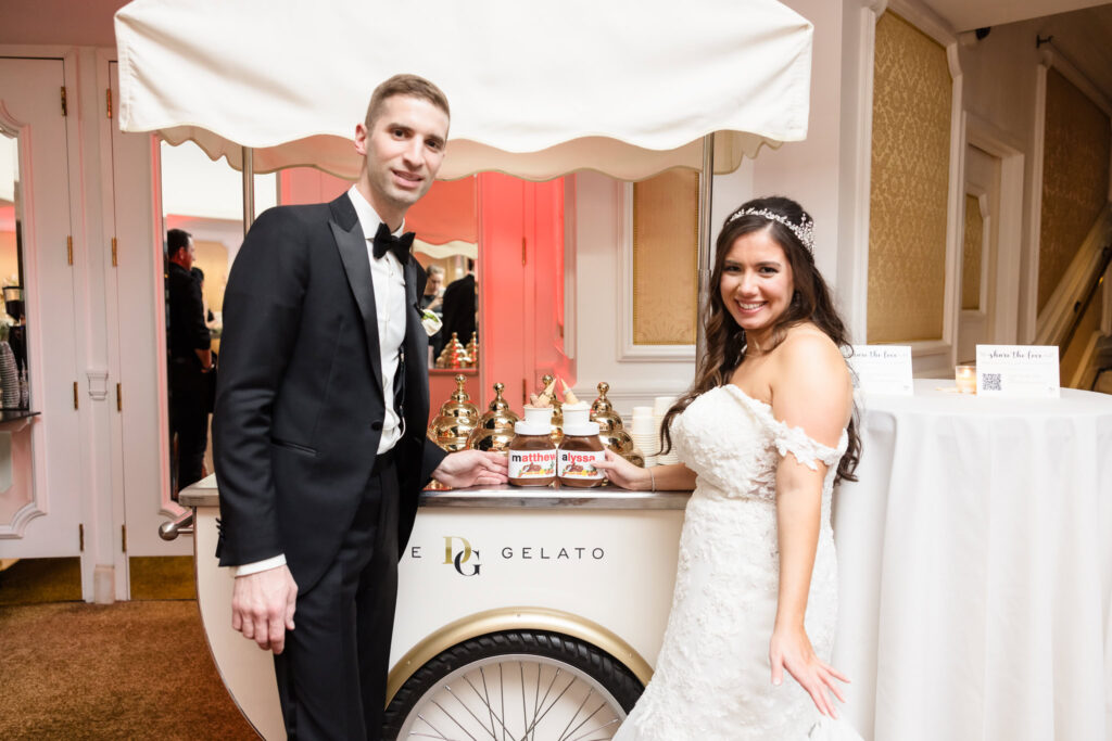 Bride and groom next to a cart from Dolce and Gelato at the Garden City Hotel. 