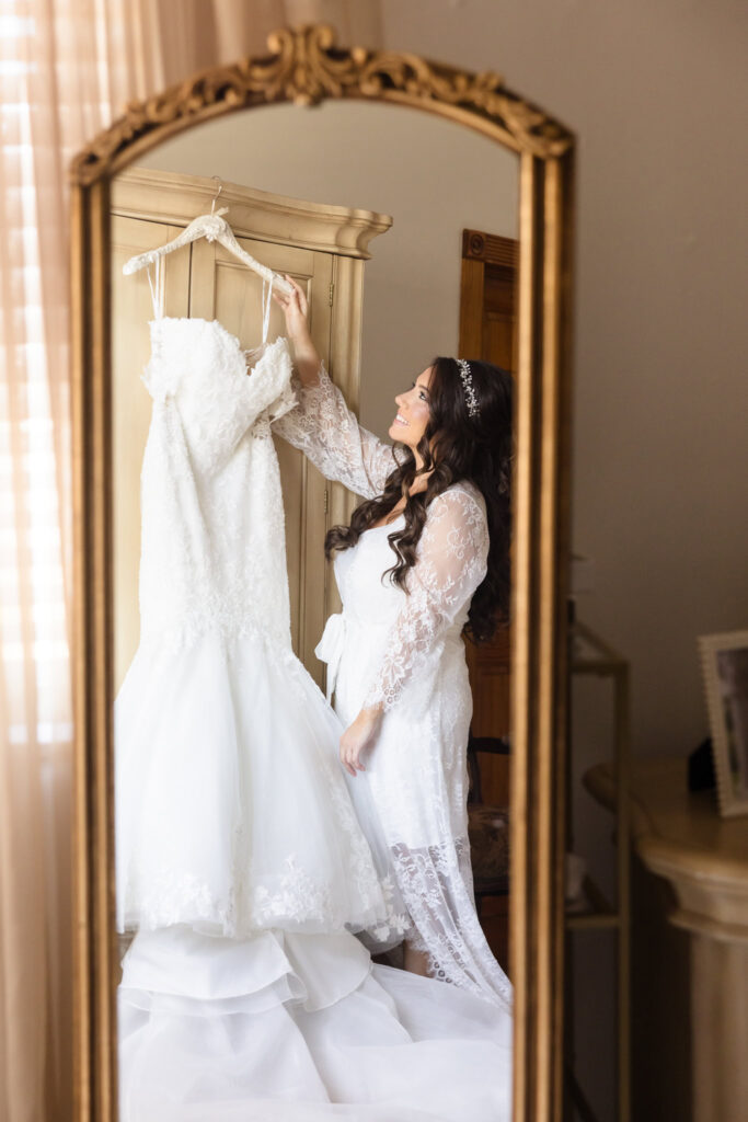 Bride picking up her dress.