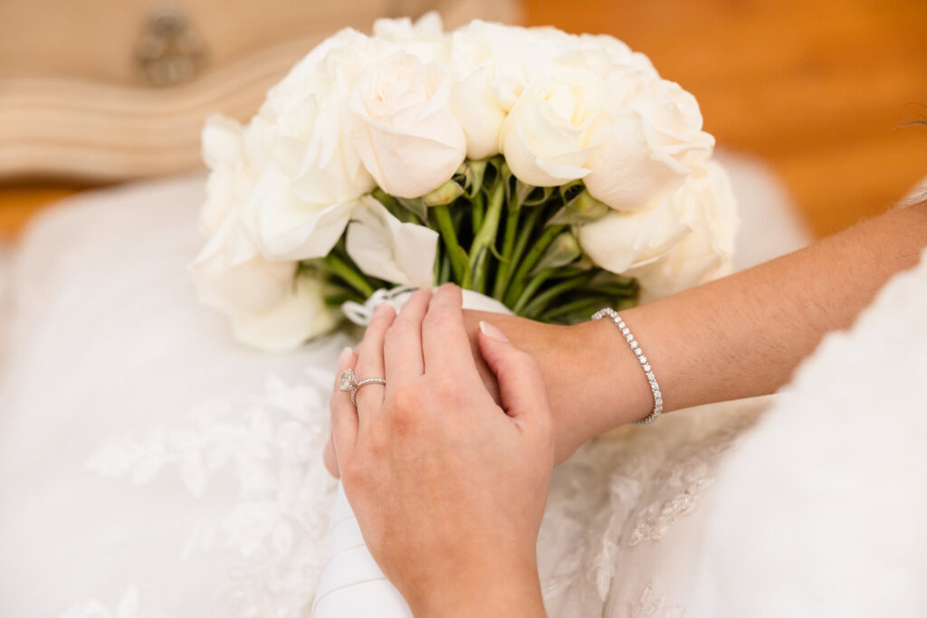 Bride's hands holding her bouquet.