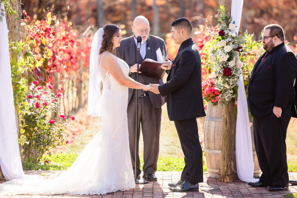 Bride and groom during ceremony at The Vineyard at East Wind Long Island. 