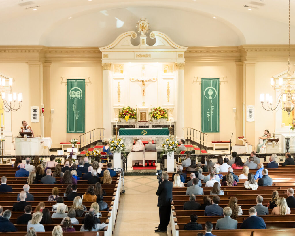 Wide shot of church during wedding ceremony.