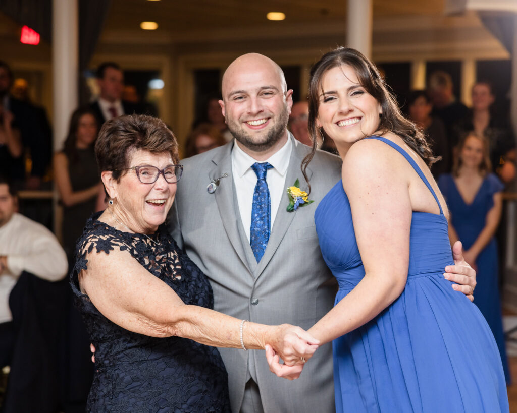 Groom dancing with guests at Sea Cliff Manor wedding 